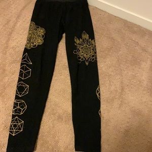 Hand crafted 95% cotton Black leggings with gold designs.